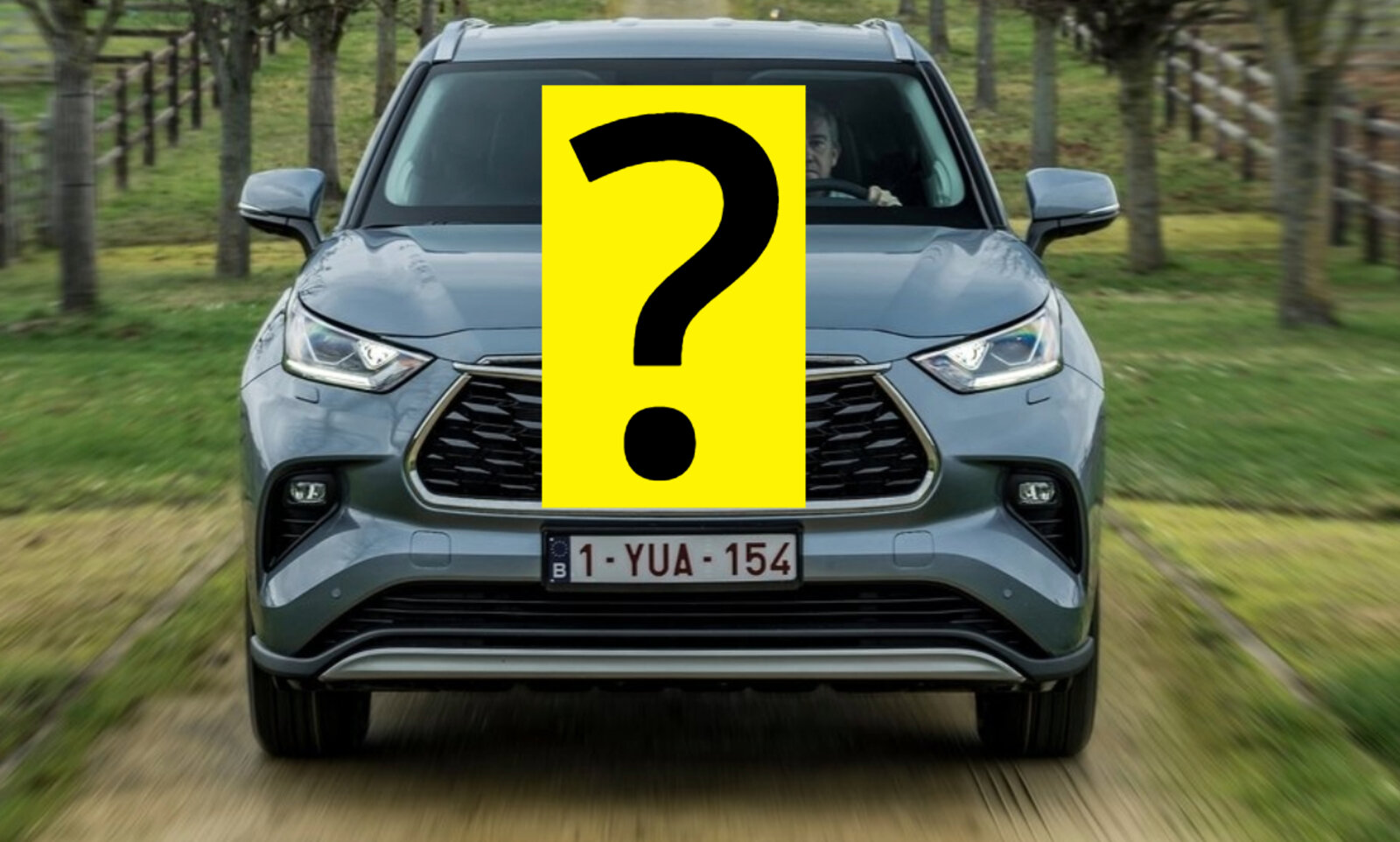 Ein SUV von vorne, teilweise durch ein Fragezeichen verdeckt.